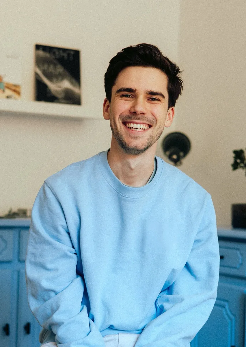 Rob Sladeczek, smiling, in a light blue sweater